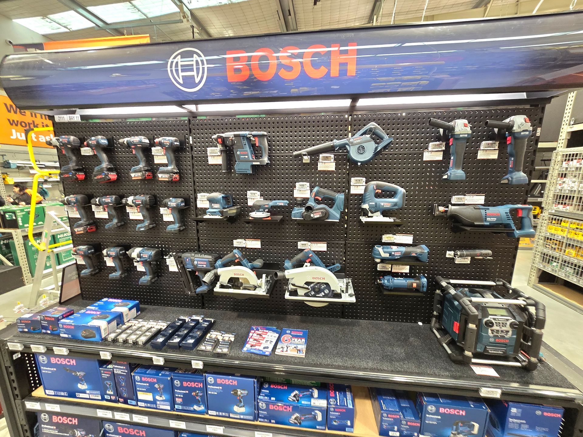 LED batten lights illuminating the back of the signs and tools at Mitre 10 Ferrymead.