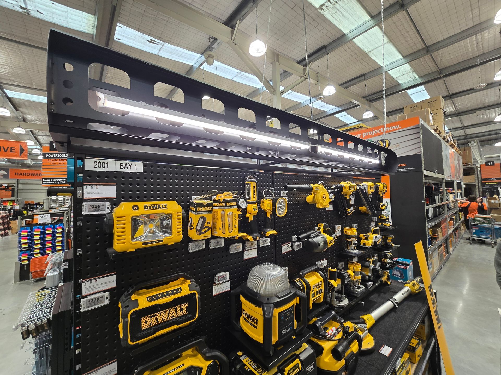 LED batten lights illuminating the back of the signs and tools at Mitre 10 Ferrymead.
