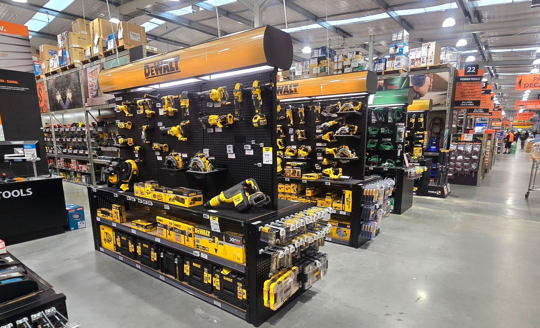 LED batten lights illuminating the back of the signs and tools at Mitre 10 Ferrymead.