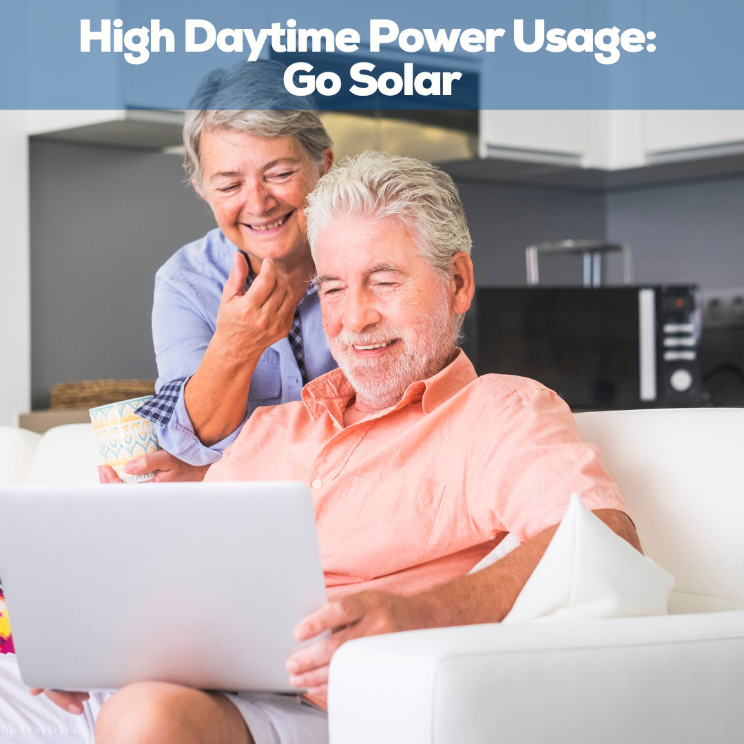 Elderly couple looking at laptop