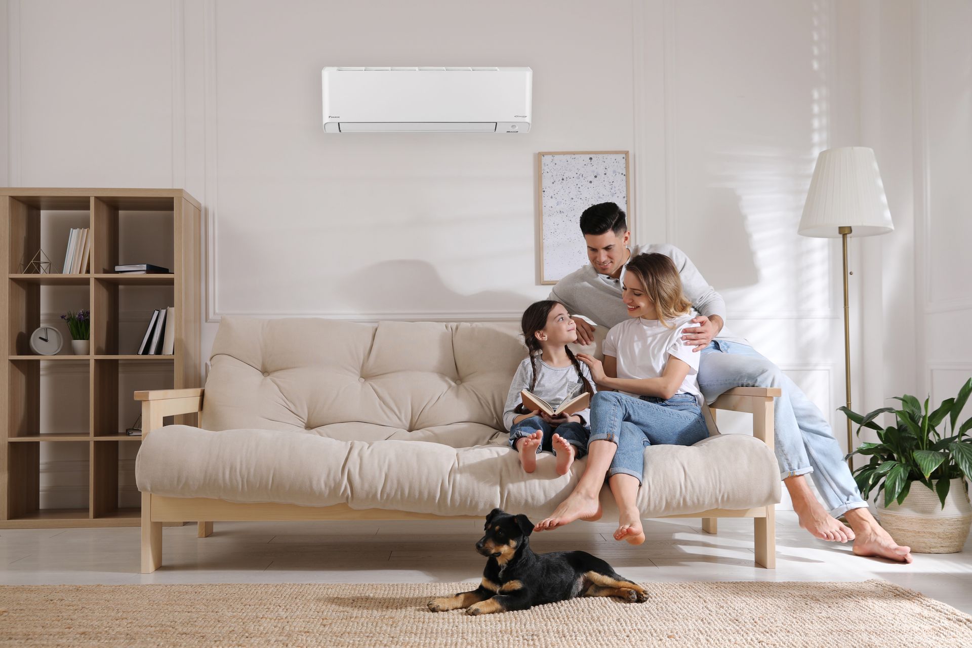 Daikin heat pump in a lounge with family and dog