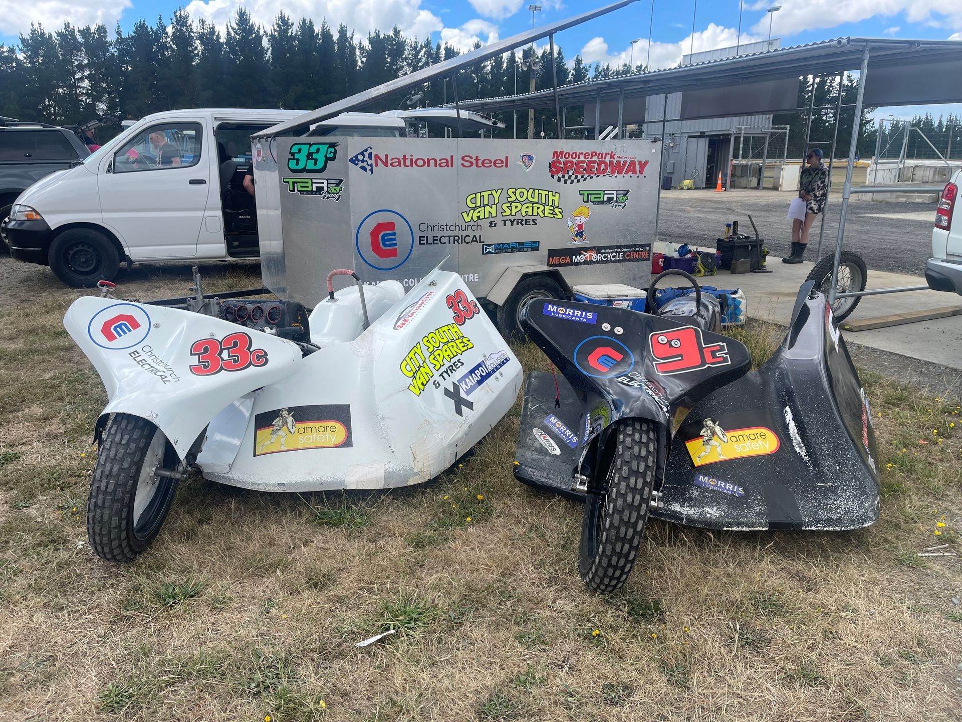 Christchurch Electrical sponsorship on two National Steel sidecar racing bikes and trailer