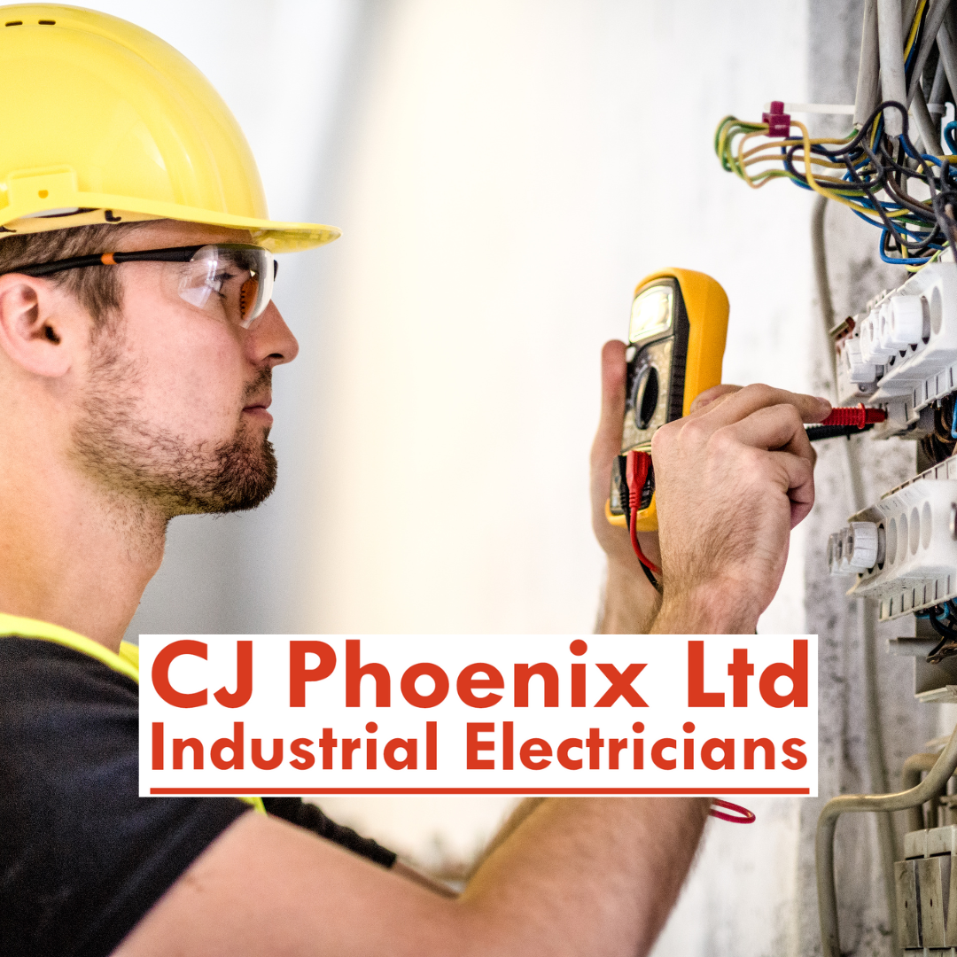 Industrial electrician with hard hat testing switchboard