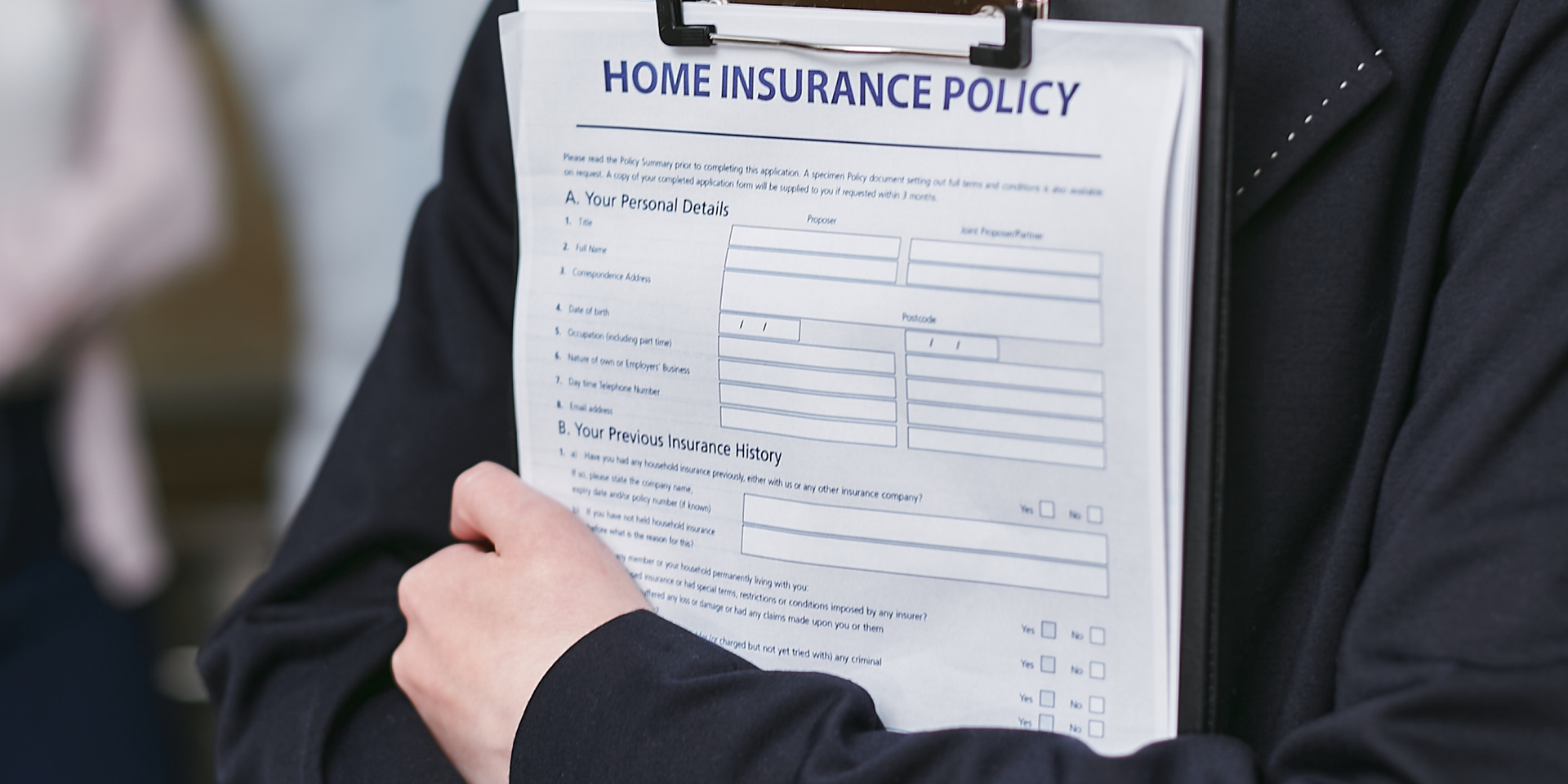 Person holding clipboard with insurance policy