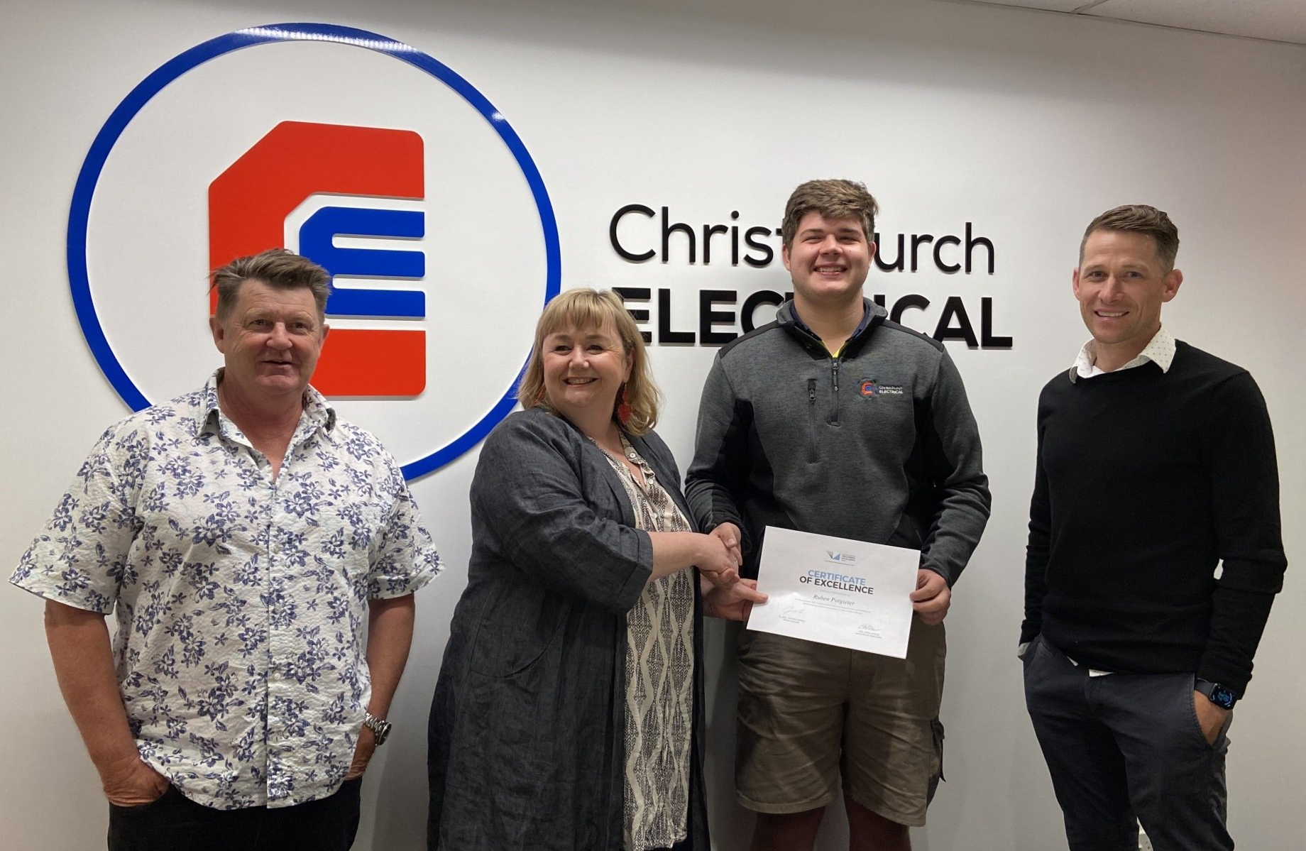 Reuben Potgieter receiving excellence award, Hon Dr Megan Woods, Jared Welsh and Rex Prebble