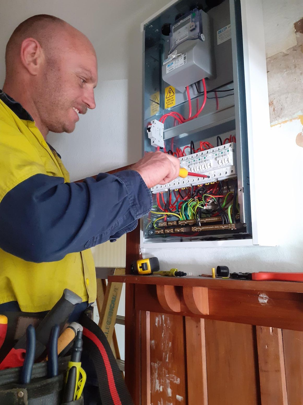 Outdated switchboard on ground, removed by Christchurch Electrical