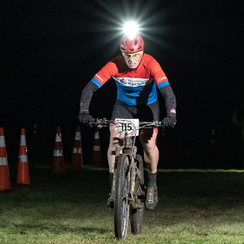 Christchurch Electrical team member riding in Muddy Gumboot biking competition