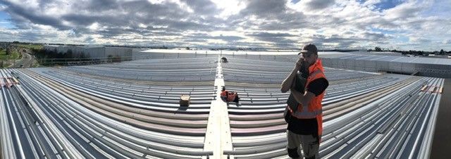 Solar installer on roof.