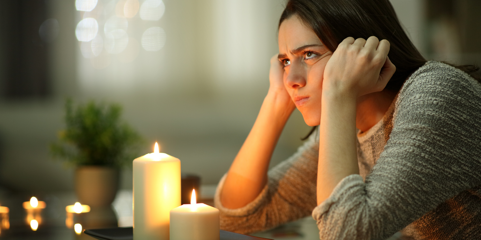 Girl with candles in a power cut