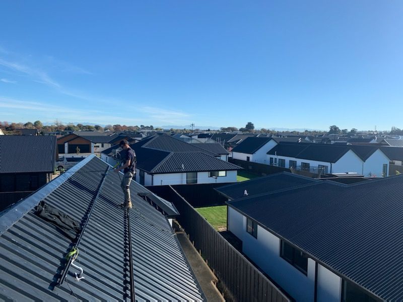 Black solar panels on residential roof in Christchurch, NZ.