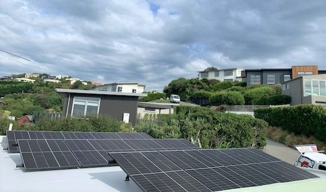 Solar panels angled for sun on residential roof.