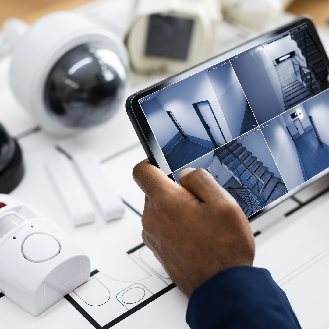 Security App displayed on a tablet showing different security camera images