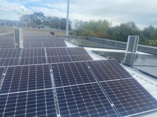 Commercial solar panels on roof.