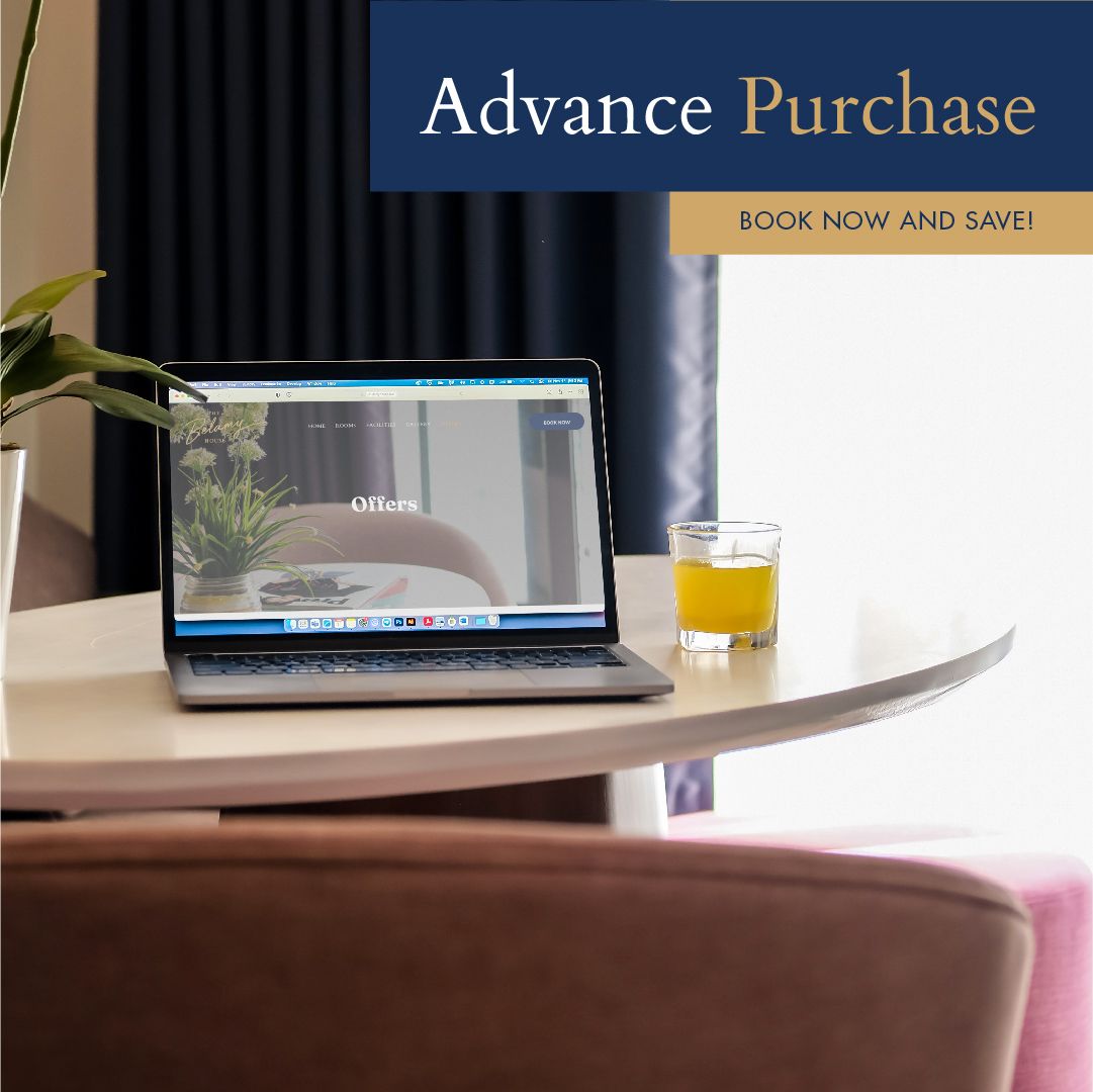 The 'Advance Purchase' deal at Belamy House, one of the best hotels in Makati City, featuring a laptop on a desk to book your affordable staycation.