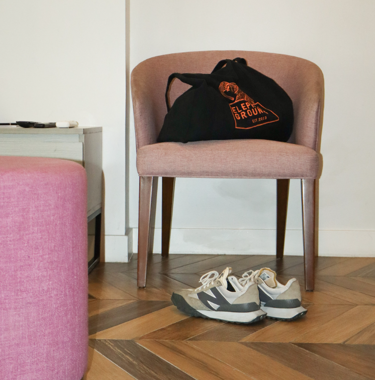 A chair with a bag on top of it that says spa amour