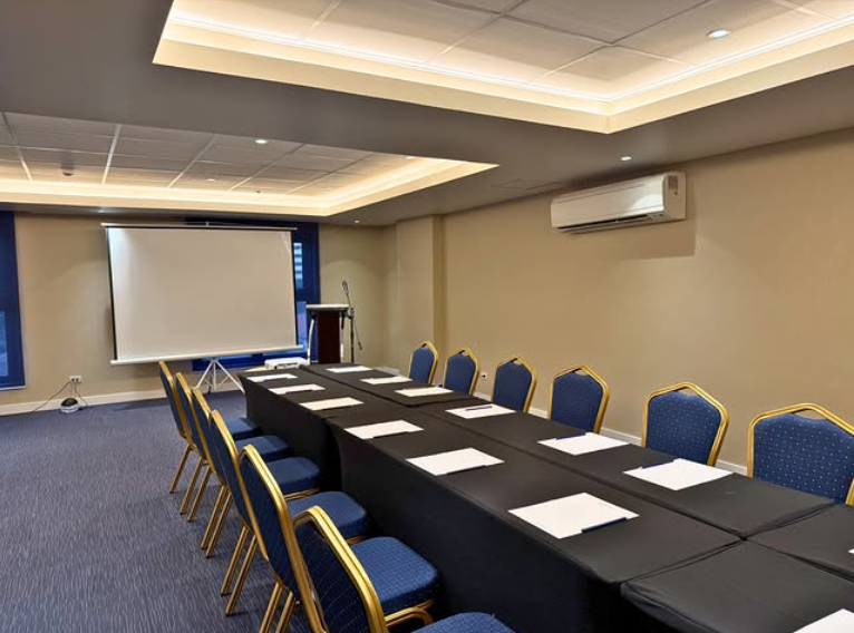 Modern conference room with a row of chairs arranged for a meeting