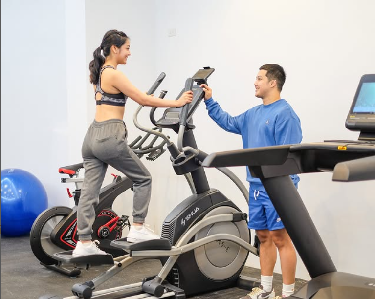 Assisting in gym services.