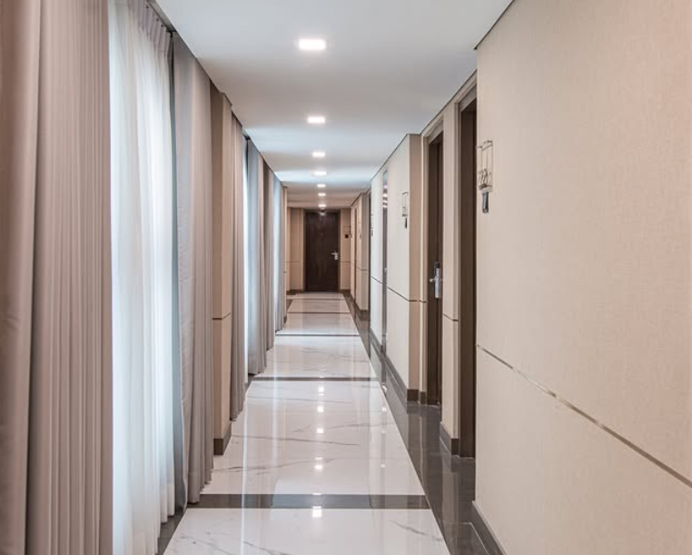Long hallway with polished floors and minimalist design elements