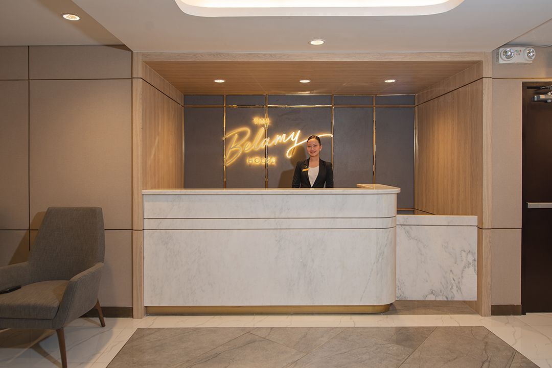 Modern lobby of Poblacion hotel with concierge at The Belamy House