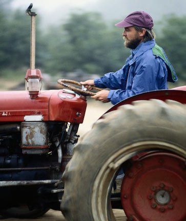 Man Driving Tractor — Spartanburg, SC — Carolina Hose & Hydraulics, Inc.