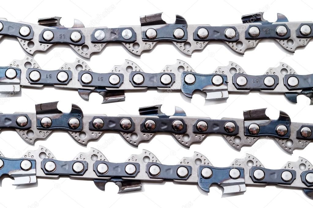 Close-up of four parallel chainsaw chains with metallic links and cutting teeth.