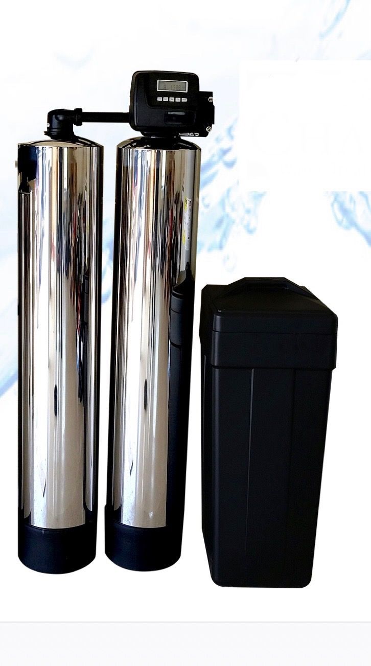 Water softener system with two shiny metal tanks and a black salt tank.