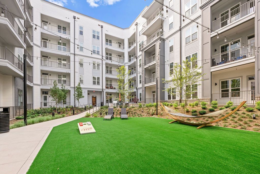 Alton Mill District exterior with corn hole