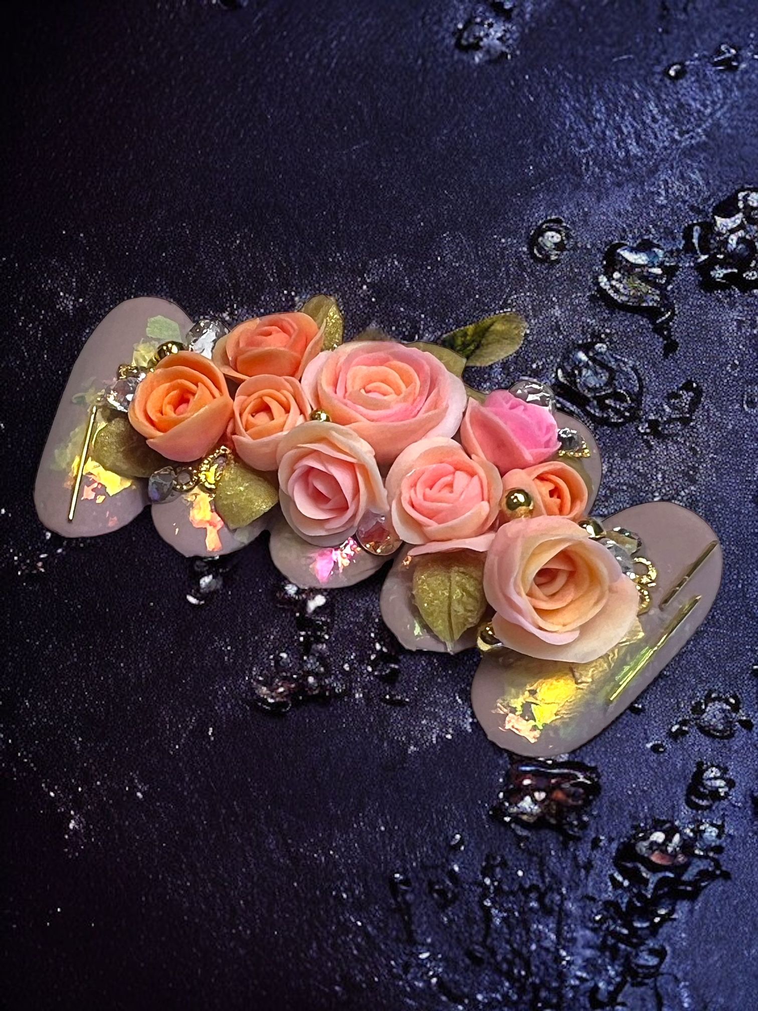 A bunch of pink roses on a black surface