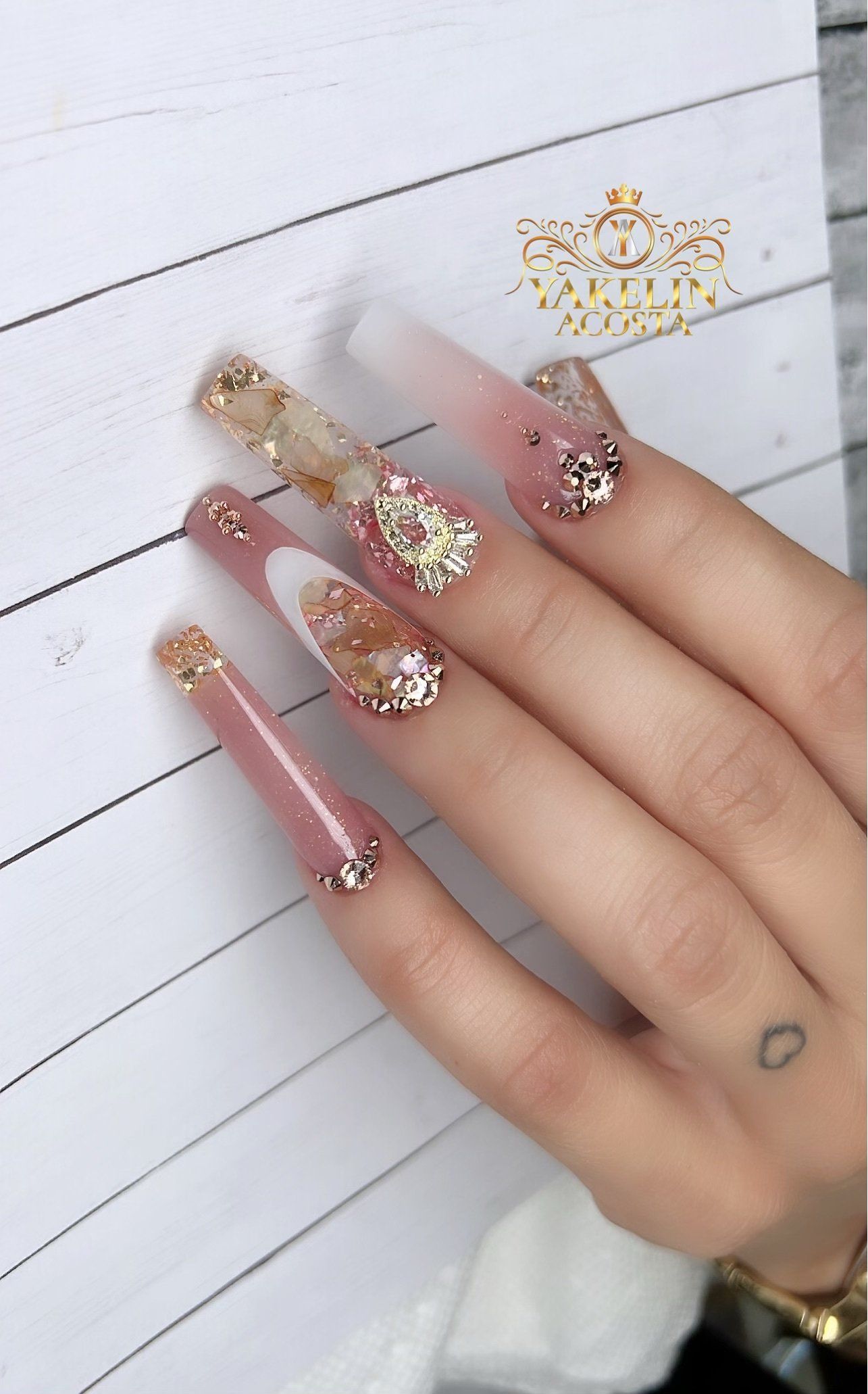 A close up of a woman 's hand with long nails