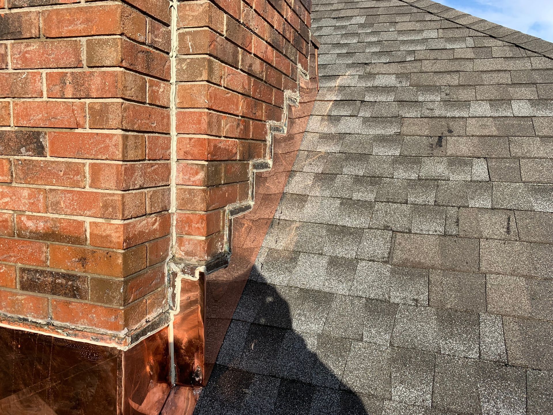 Copper chimney saddle and flashing installation CT by Executive Homes LLC