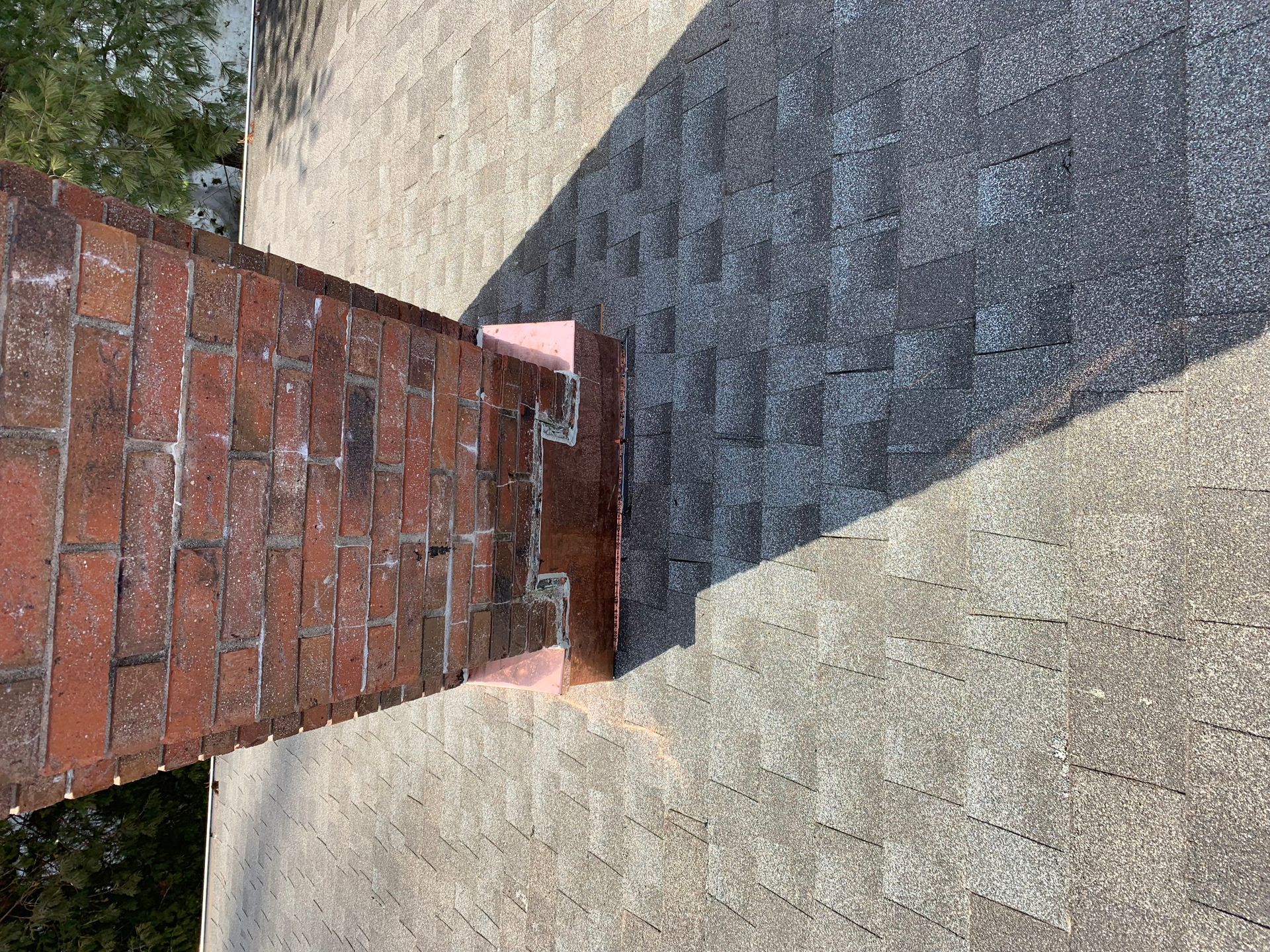 Copper chimney saddle and flashing installation CT by Executive Homes LLC