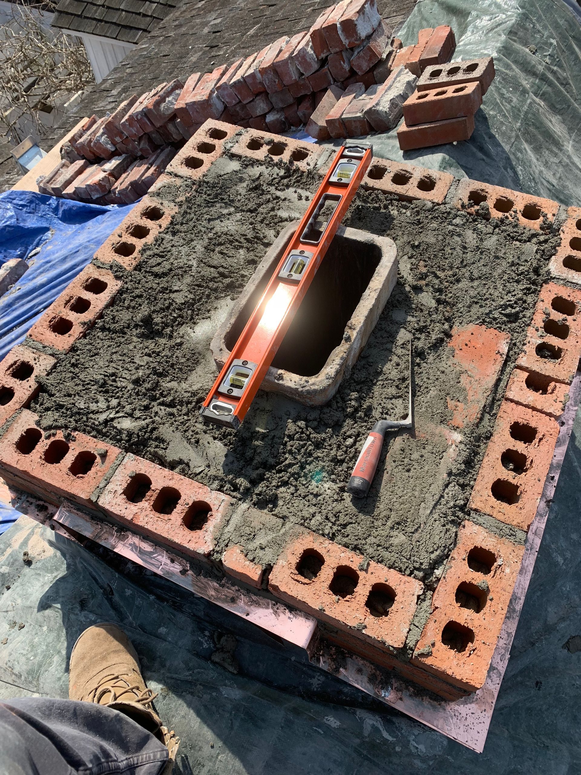 Chimney repair specialist at work Stamford CT by Executive Homes LLC