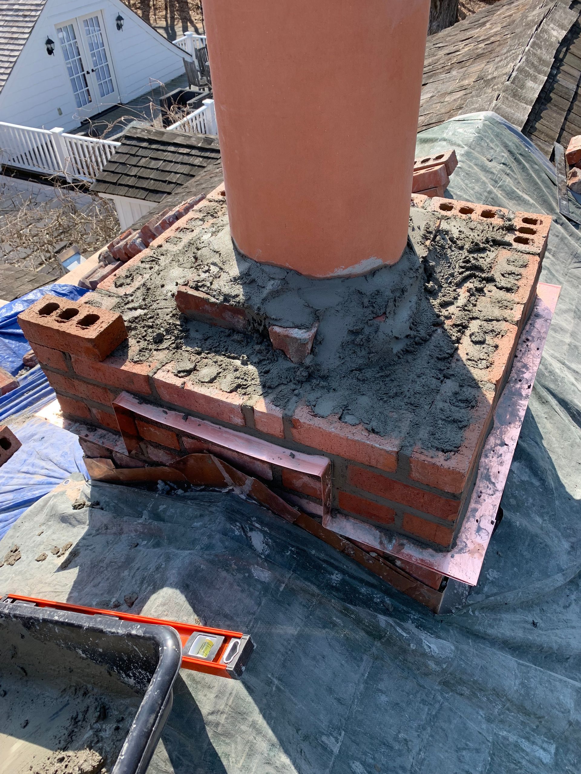 Chimney repair specialist at work Stamford CT by Executive Homes LLC