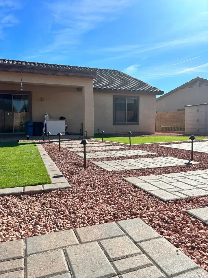 A house with a lot of bricks in front of it