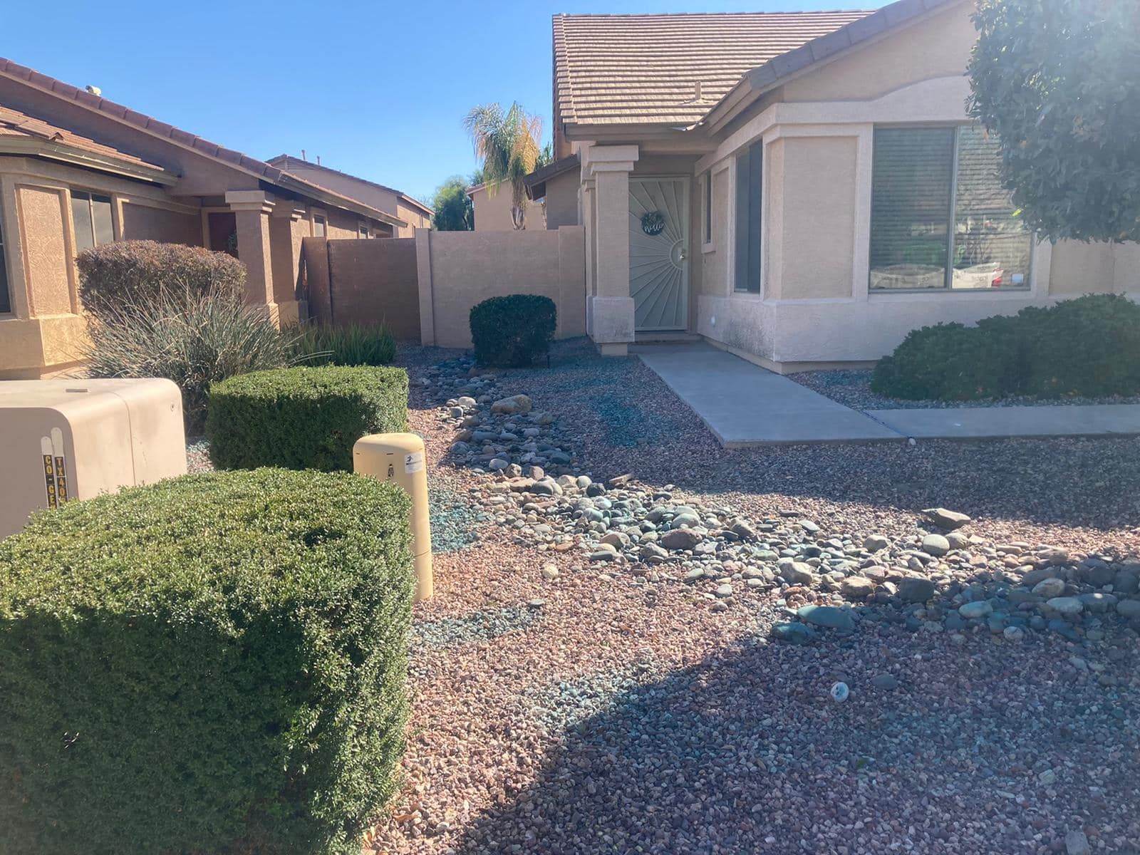 A house with a lot of rocks in front of it