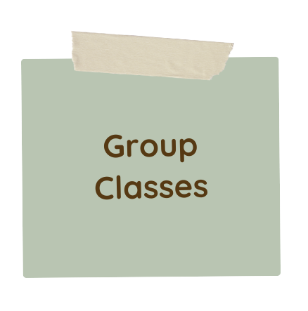 A piece of paper taped to a wall with the words `` group classes '' written on it.