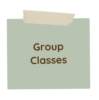 A piece of paper taped to a wall with the words `` group classes '' written on it.