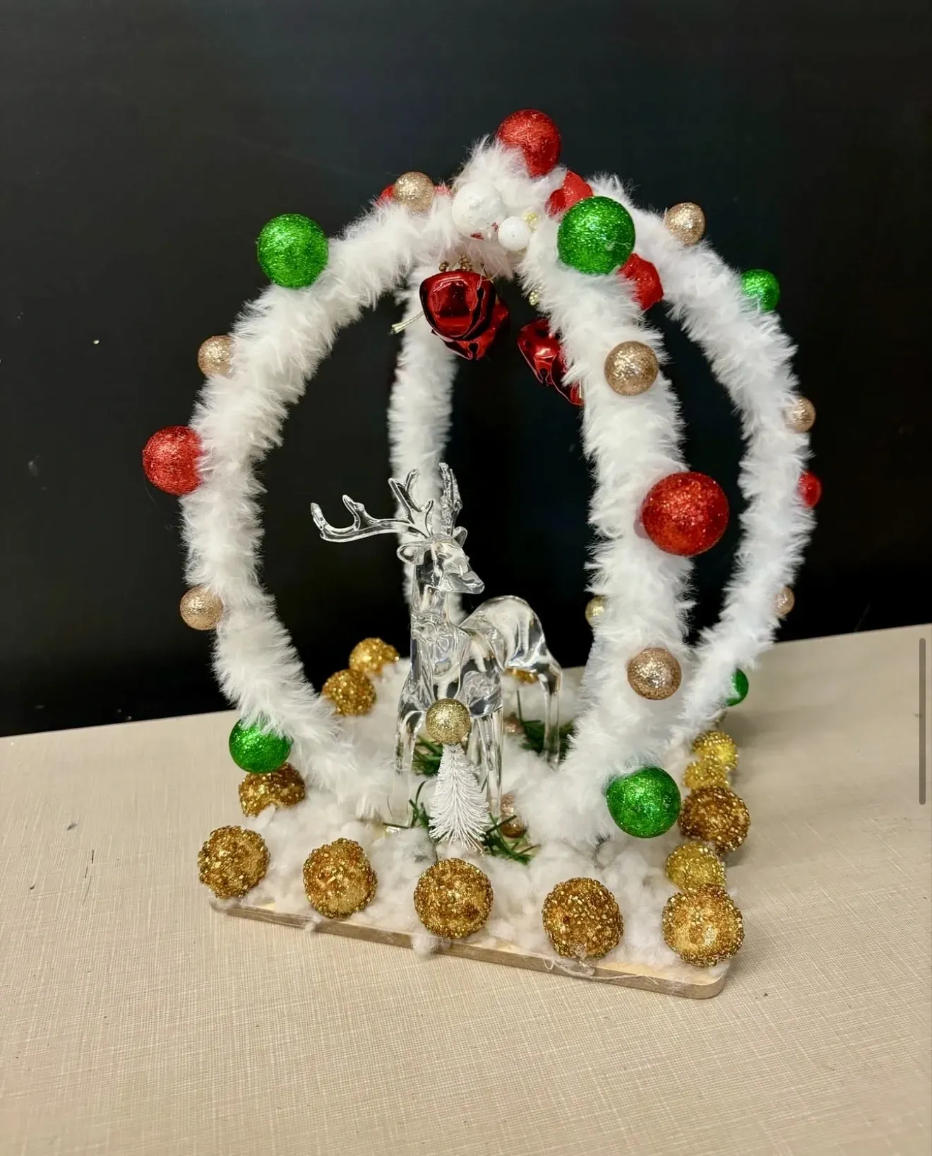 A christmas wreath with a deer in it