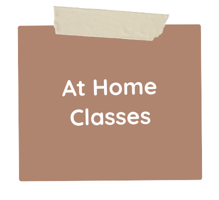 A brown piece of paper with tape on it that says `` at home classes ''.