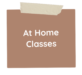 A brown piece of paper with tape on it that says `` at home classes ''.