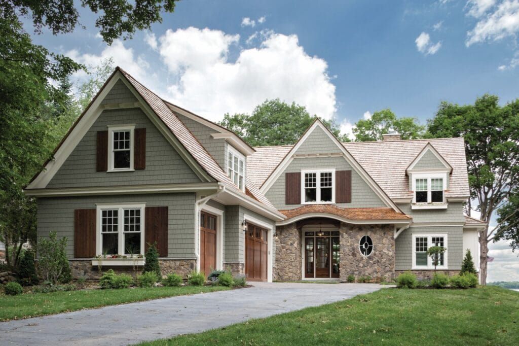 A large house with a lot of windows and shutters