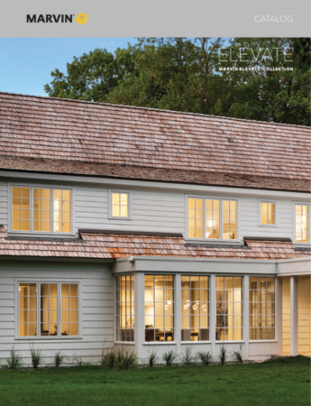 A modern wooden house with a black garage door