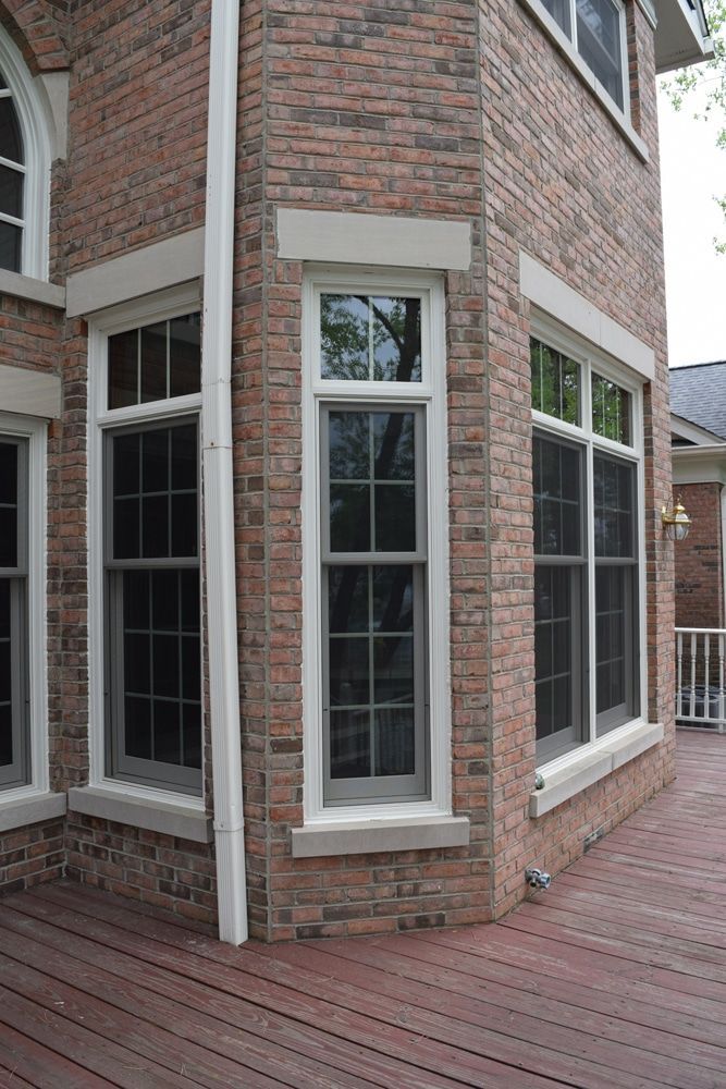 A brick building with a lot of windows on it