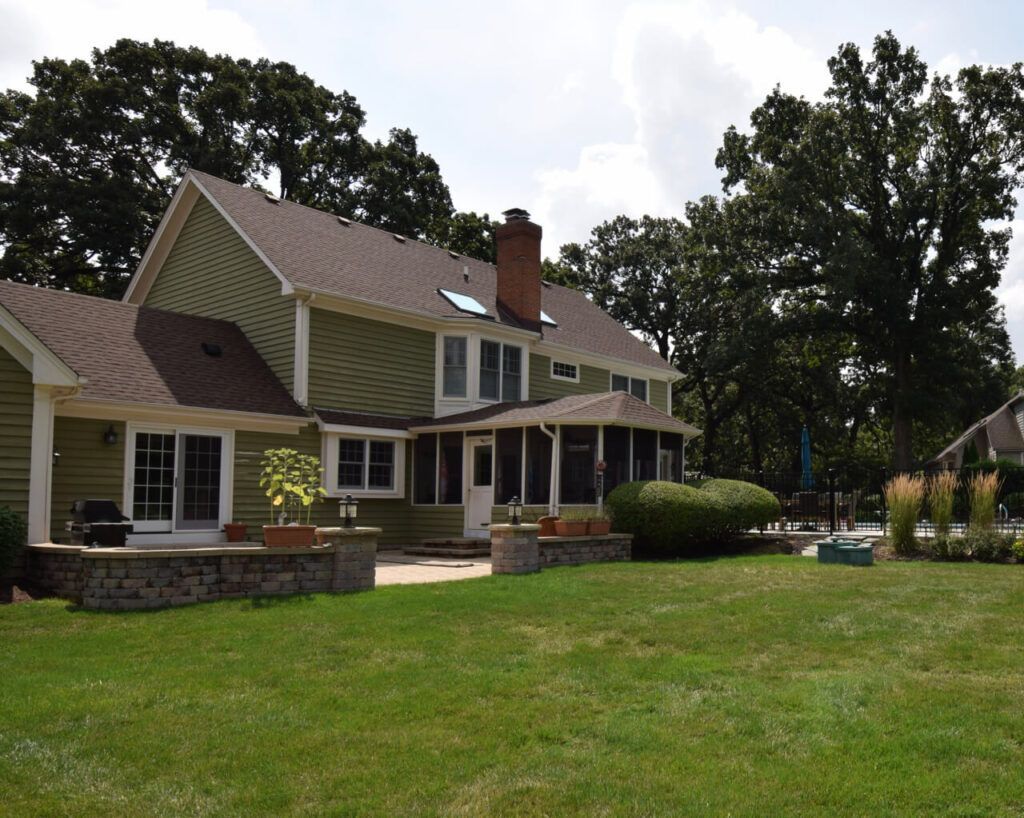 A large house with a large lawn in front of it