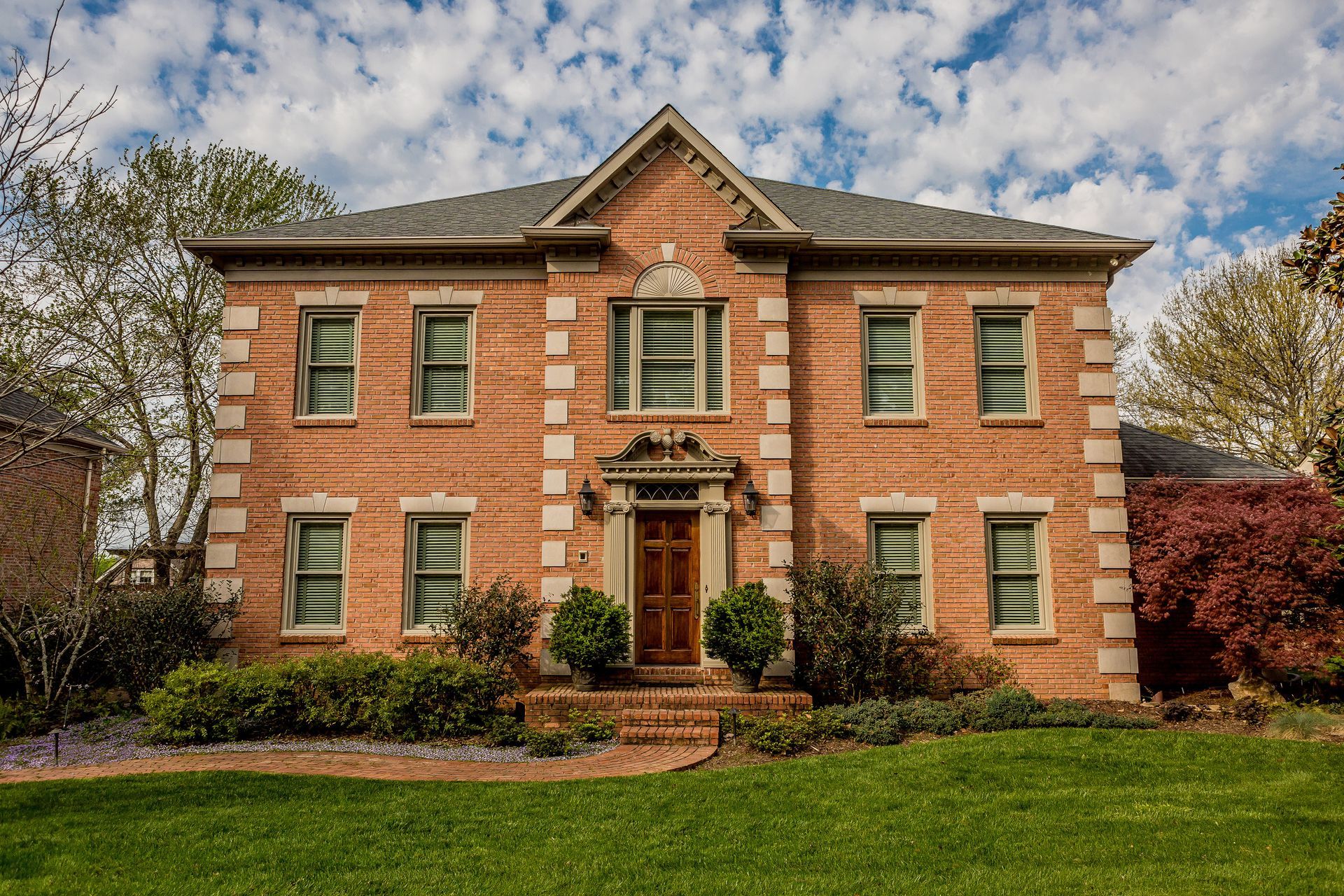 A kitchen with a sink and a lot of windows