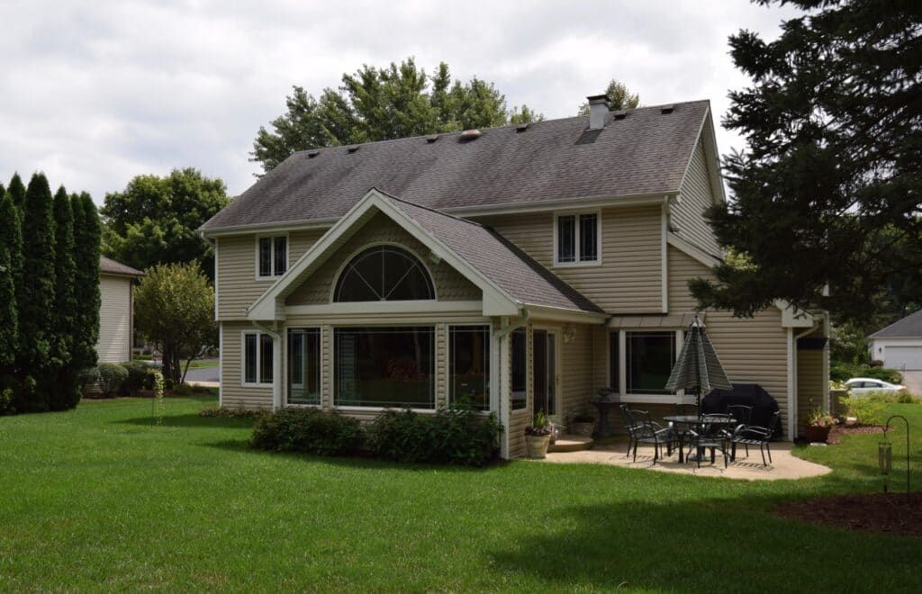 A large house with a large lawn in front of it