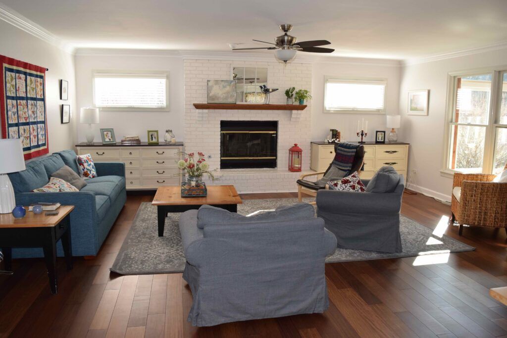 A living room filled with furniture and a fireplace.