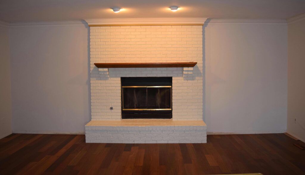 There is a fireplace in the middle of the room.