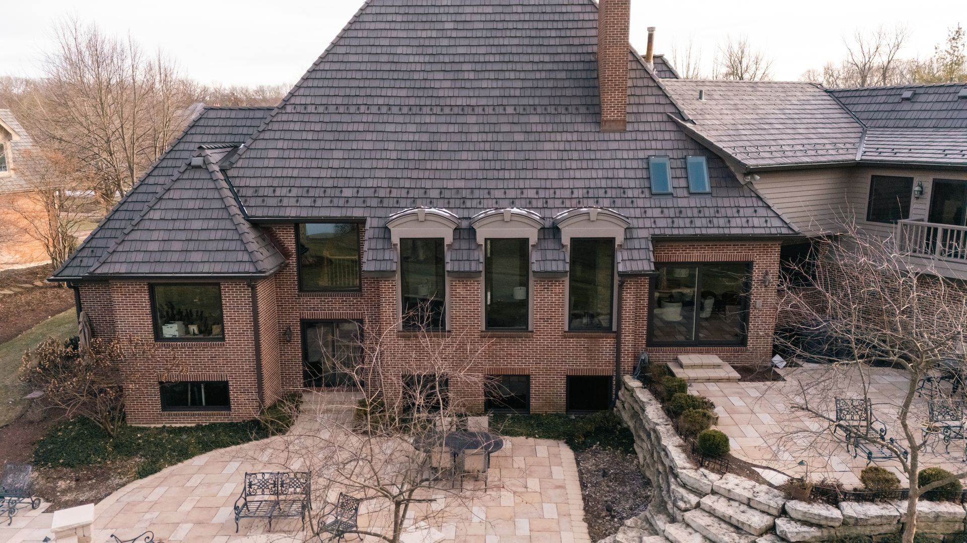 A bedroom with a large bed and sliding glass doors.