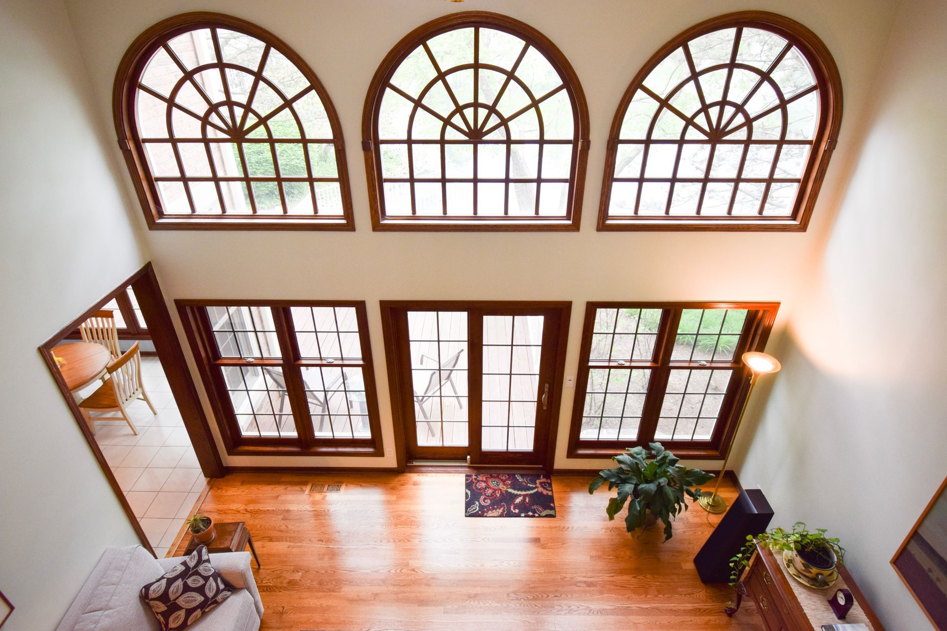 An aerial view of a living room with arched windows